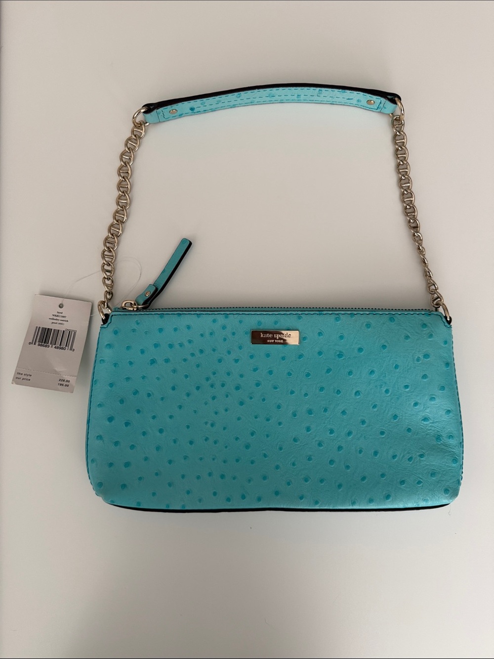 kate spade turquoise pebble-embossed chain wristlet